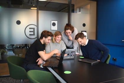 people sitting on chair in front of laptop computers